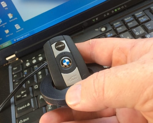 Man Holding BMW Car Key